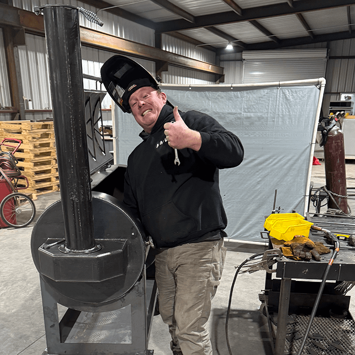 Dustin of Smokeslinger Pits building a Liberty94 offset smoker