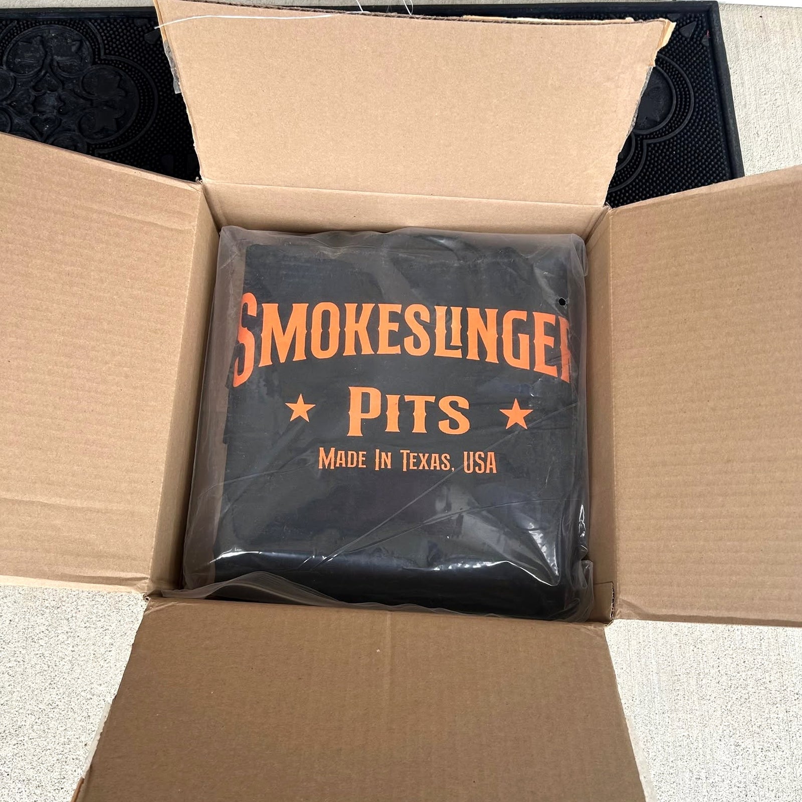 Full Size Smokeslinger Cover with Counterweight packed in its shipping box